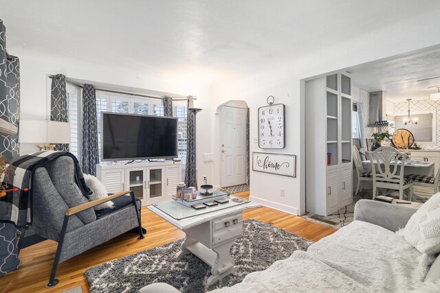 bedroom with ceiling fan and wood-type flooring