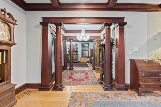 hall with beamed ceiling, baseboards, decorative columns, and a notable chandelier