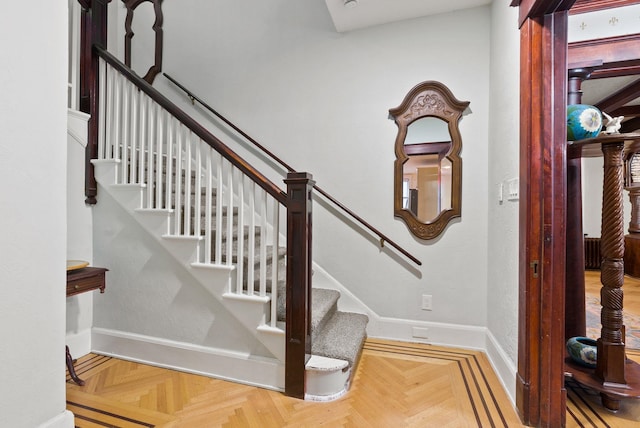 stairs featuring baseboards