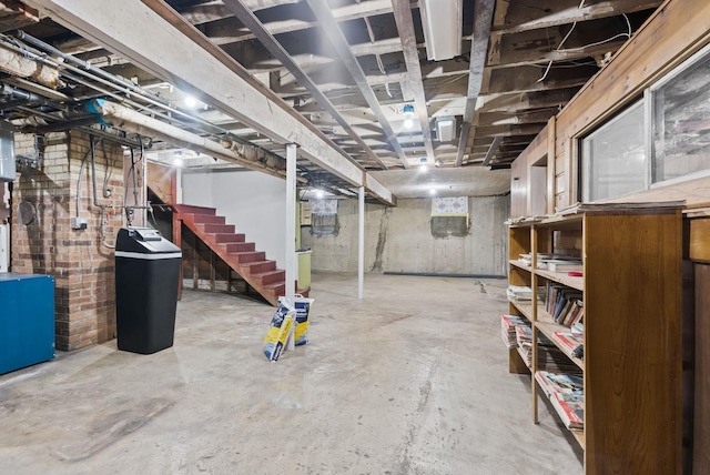 unfinished below grade area featuring stairs
