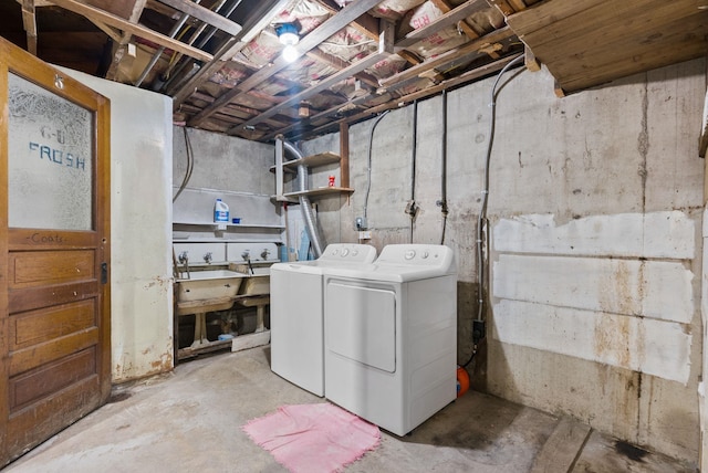 clothes washing area featuring washing machine and clothes dryer and laundry area