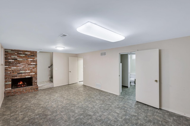 unfurnished living room featuring a fireplace