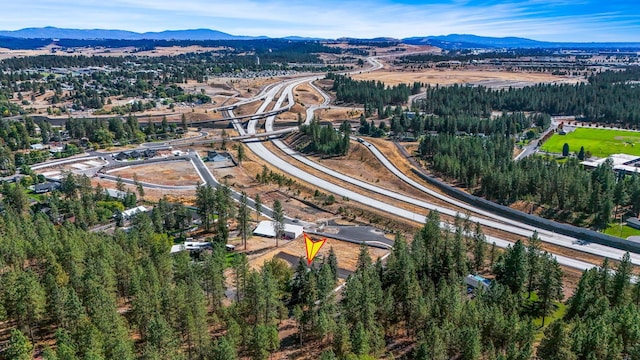 birds eye view of property with a mountain view