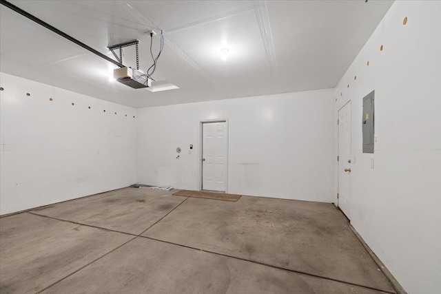 garage featuring a garage door opener and electric panel