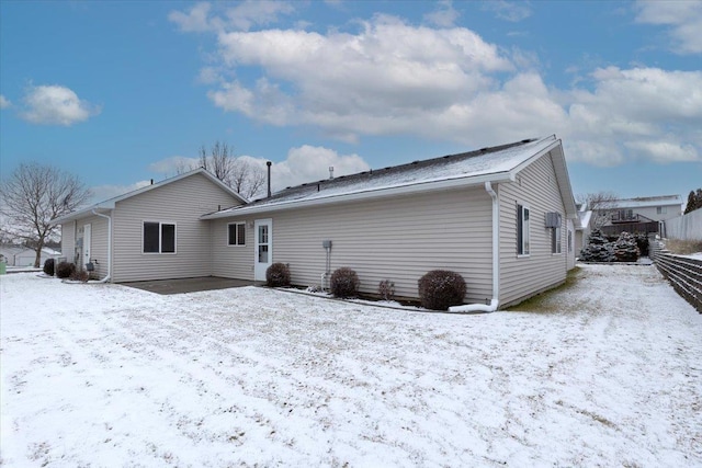 view of snow covered house