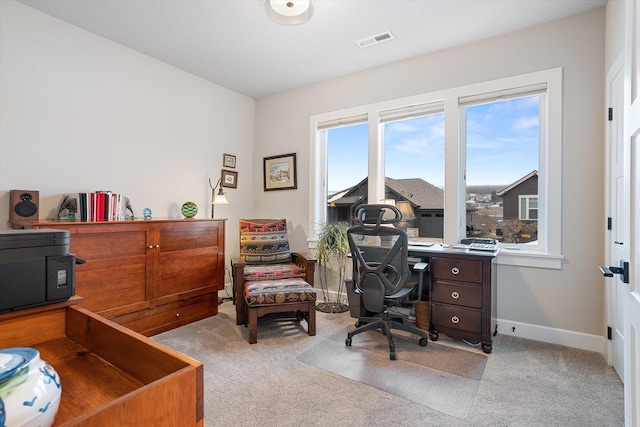 office area featuring light carpet