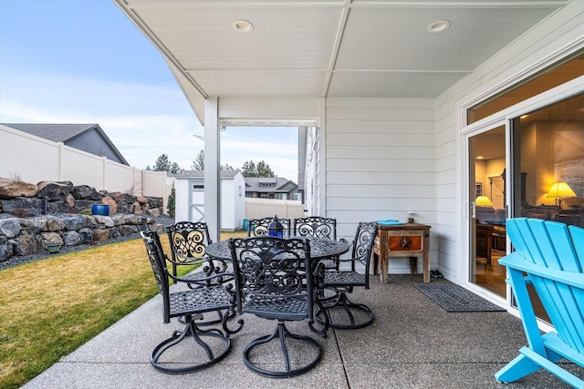 view of patio / terrace featuring a shed