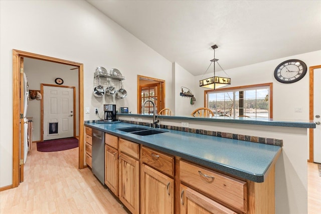 kitchen with vaulted ceiling, pendant lighting, stainless steel dishwasher, light hardwood / wood-style flooring, and sink