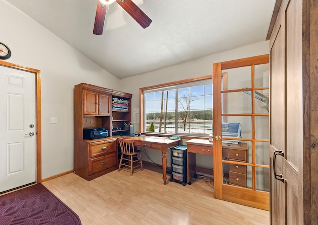 home office featuring ceiling fan, lofted ceiling, and light hardwood / wood-style flooring