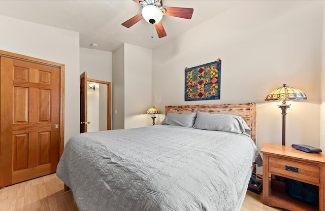 bedroom with ceiling fan and light hardwood / wood-style floors