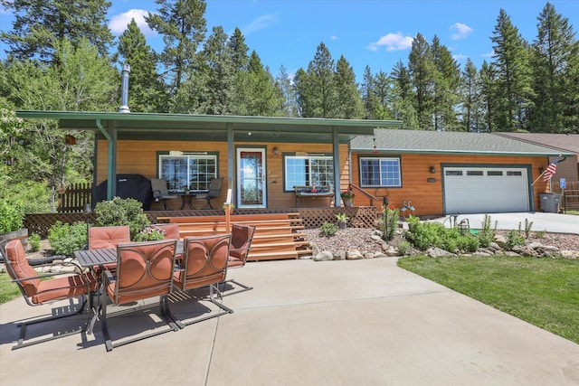 exterior space with a garage and a porch