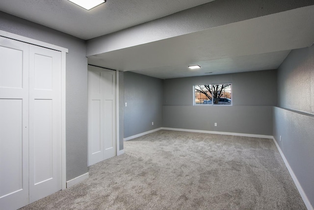 basement with light colored carpet