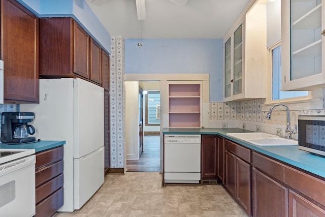 kitchen with ceiling fan, decorative backsplash, sink, and white appliances