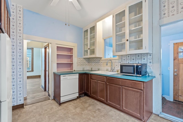 kitchen with ceiling fan, sink, and white appliances