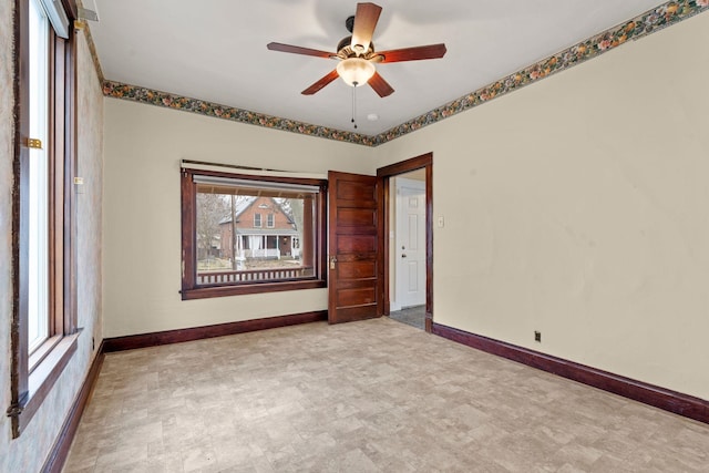 unfurnished room featuring ceiling fan