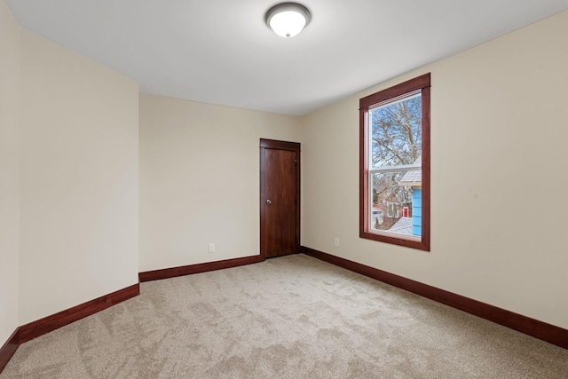 empty room featuring light colored carpet