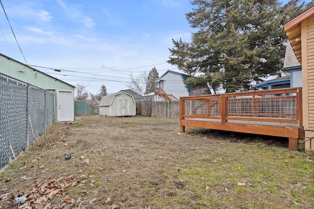 view of yard featuring a shed and a deck