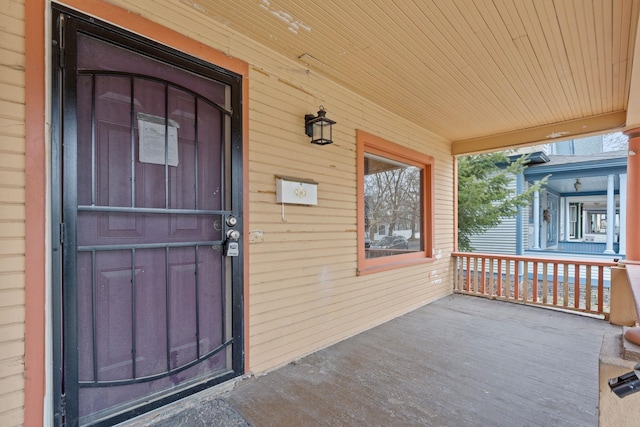 doorway to property featuring a porch