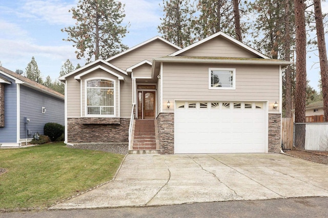 view of front of home with a garage and a front yard