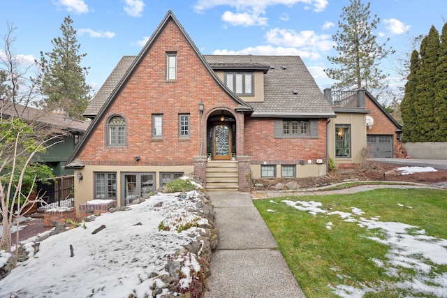 tudor-style house with a lawn