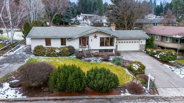 view of front of house with a front lawn and a garage