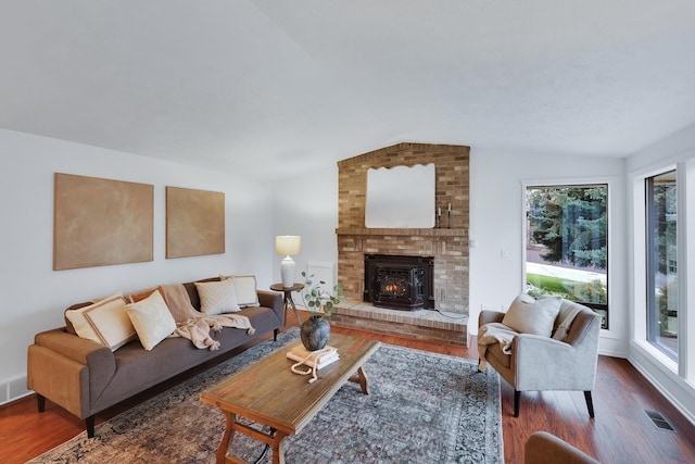 living room with vaulted ceiling and dark wood-type flooring