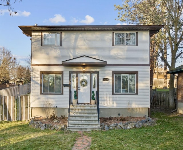 front of property featuring a front lawn