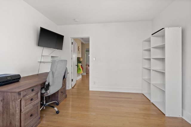 office with light wood-type flooring