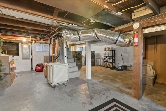 basement with washer and dryer and electric panel