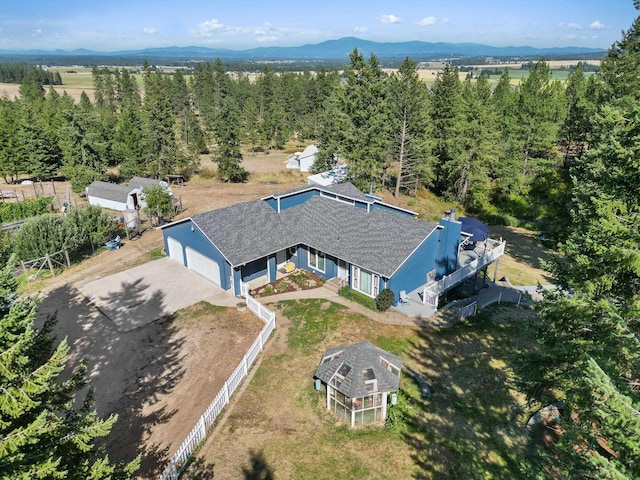 birds eye view of property with a mountain view