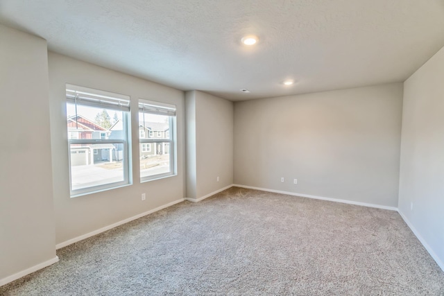 unfurnished room featuring carpet flooring