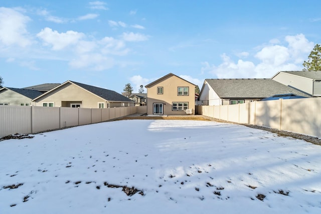 view of yard layered in snow