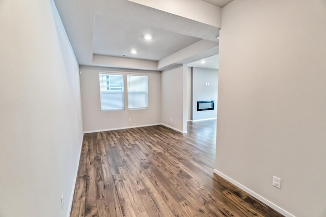 empty room with hardwood / wood-style flooring