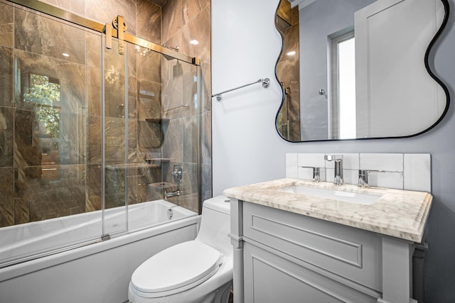 full bathroom featuring combined bath / shower with glass door, vanity, and toilet