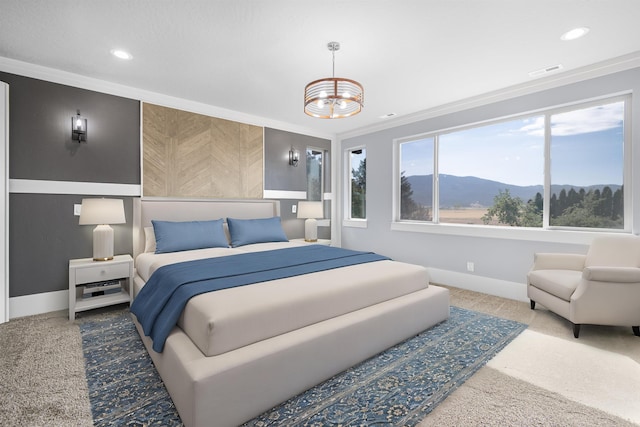 bedroom featuring ornamental molding, a mountain view, carpet floors, and a notable chandelier