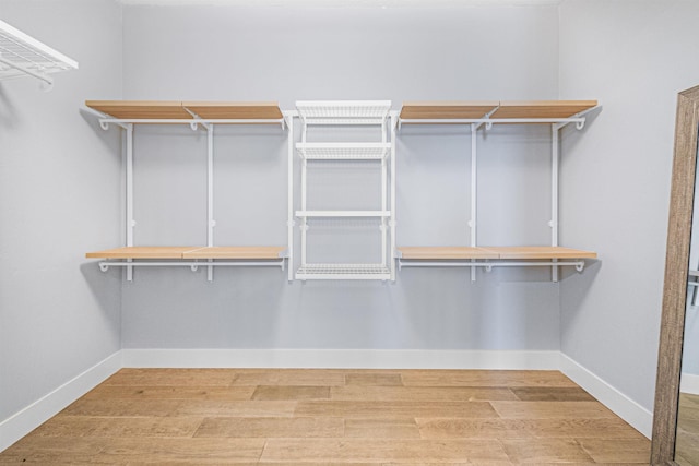 walk in closet featuring hardwood / wood-style floors