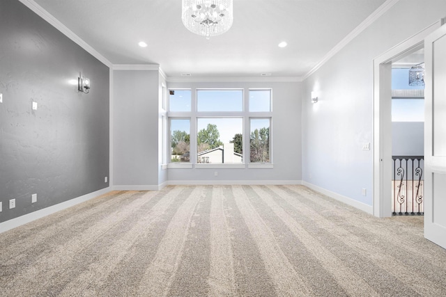 carpeted empty room with ornamental molding and a chandelier