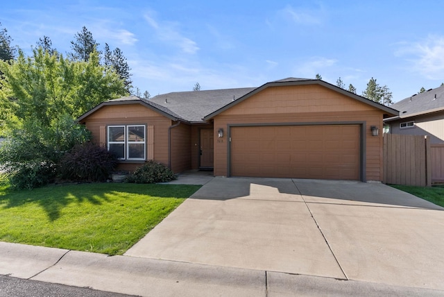 single story home featuring a garage and a front lawn