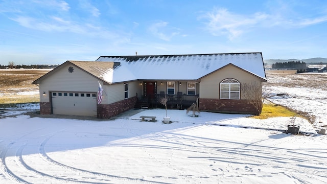 view of front of home featuring a garage and a porch