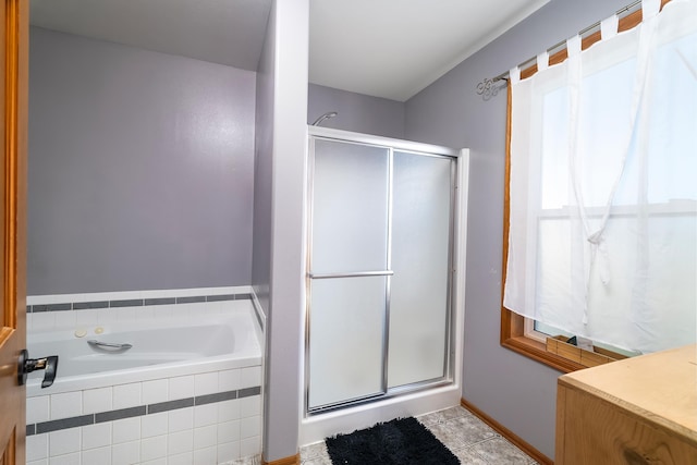 bathroom featuring tile patterned flooring and shower with separate bathtub