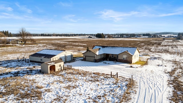 snowy aerial view with a rural view