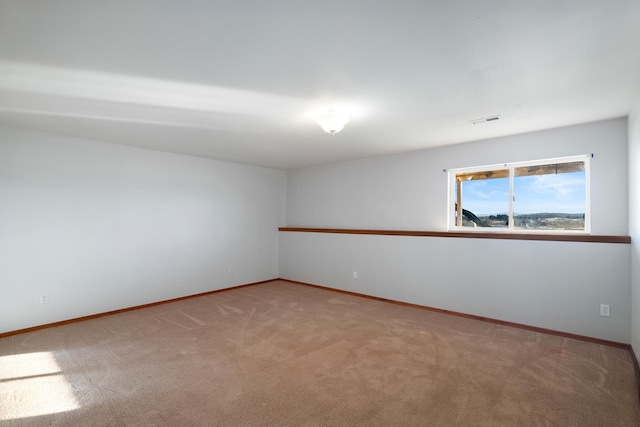 unfurnished room featuring carpet floors