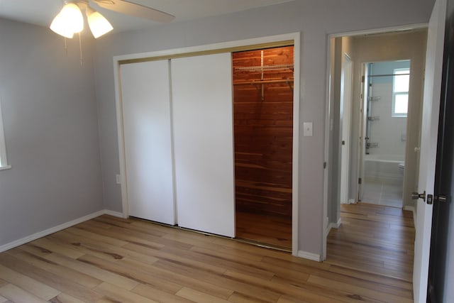 unfurnished bedroom with ceiling fan and light hardwood / wood-style flooring