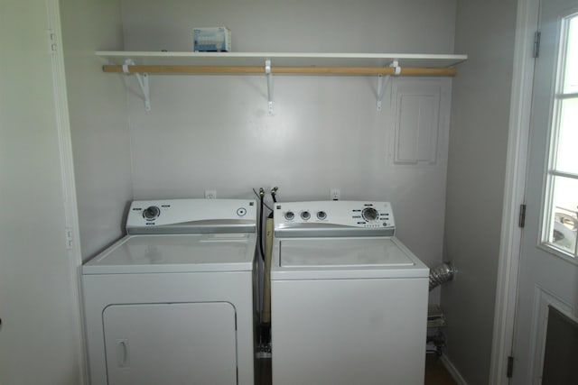 clothes washing area with washer and dryer