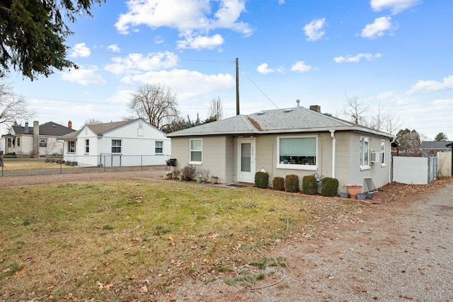 back of house featuring cooling unit and a yard