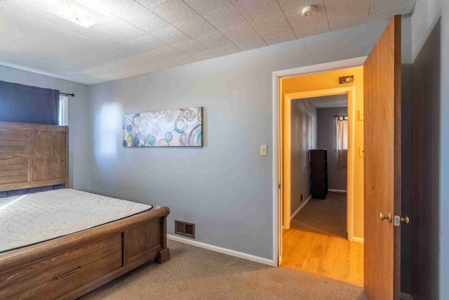 bedroom featuring carpet