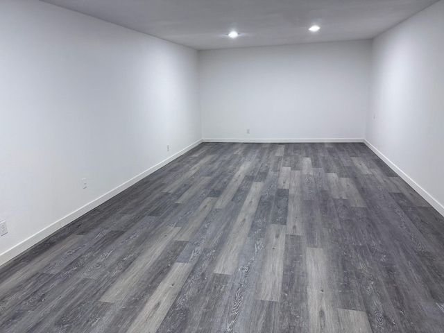 spare room with dark hardwood / wood-style flooring