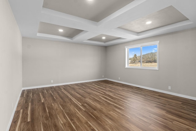 empty room with dark wood-type flooring, recessed lighting, baseboards, and coffered ceiling