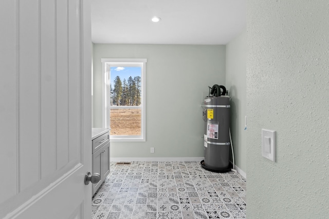utility room featuring secured water heater