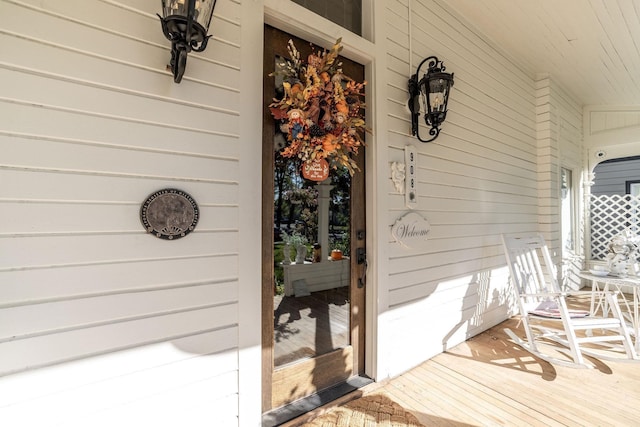 view of exterior entry with covered porch